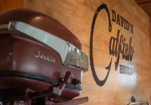 Boat motor and the logo of David's Catfish house in Dothan